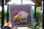 Yellow elephant with orange balloon